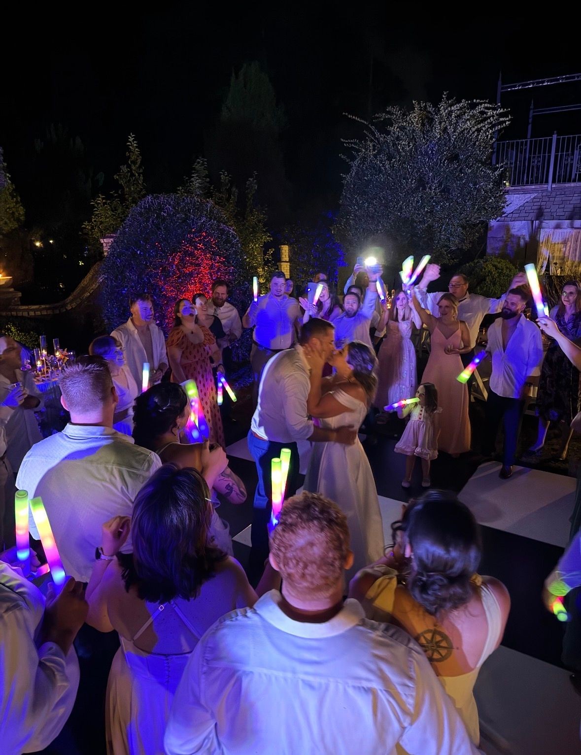 Bride and groom celebrating on a packed wedding dance floor with Good Vibrations Events, an Asheville wedding DJ and MC company